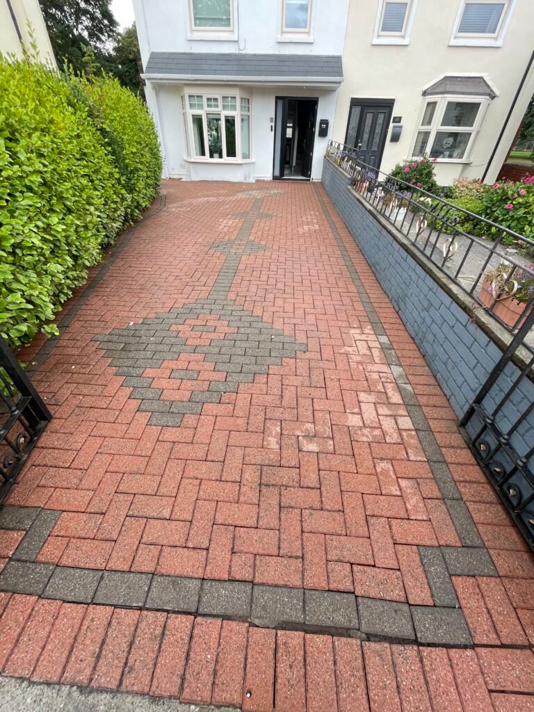 Red block-paved driveway after XPress Wash cleaning